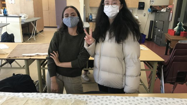 Students in the Textiles 9-12 class working on their pattern layouts for coats, pajama pants, flared pants and culottes.