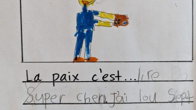 Peace is reading Dog Man.